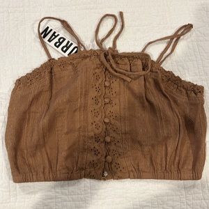 New with tags Urban Outfitters crop tank with eyelet detail.